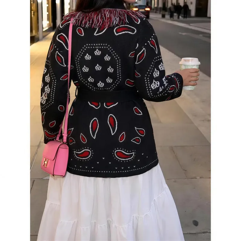 Back view of the black bandana fringe cardigan worn on the street