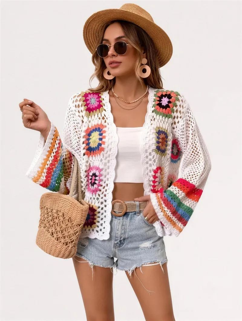 Granny square crochet cardigan in white, worn open over a white top