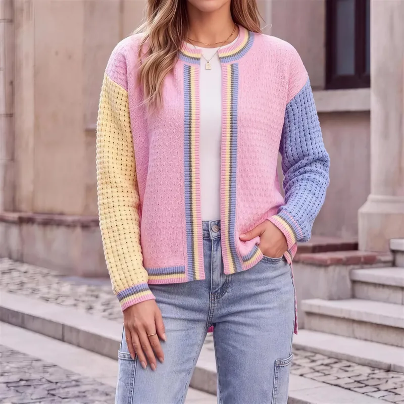 Patchwork sleeve cardigan worn open over a white tee with jeans