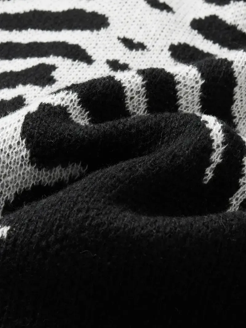 Macro of the knitted-in bone jacquard, black ground with cream bones