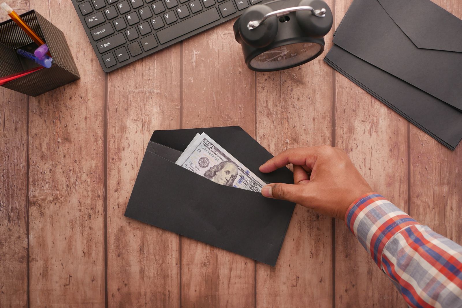 100 Envelope Savings Challenge FAQ: Pay Off Debt & Build Cash Reserves