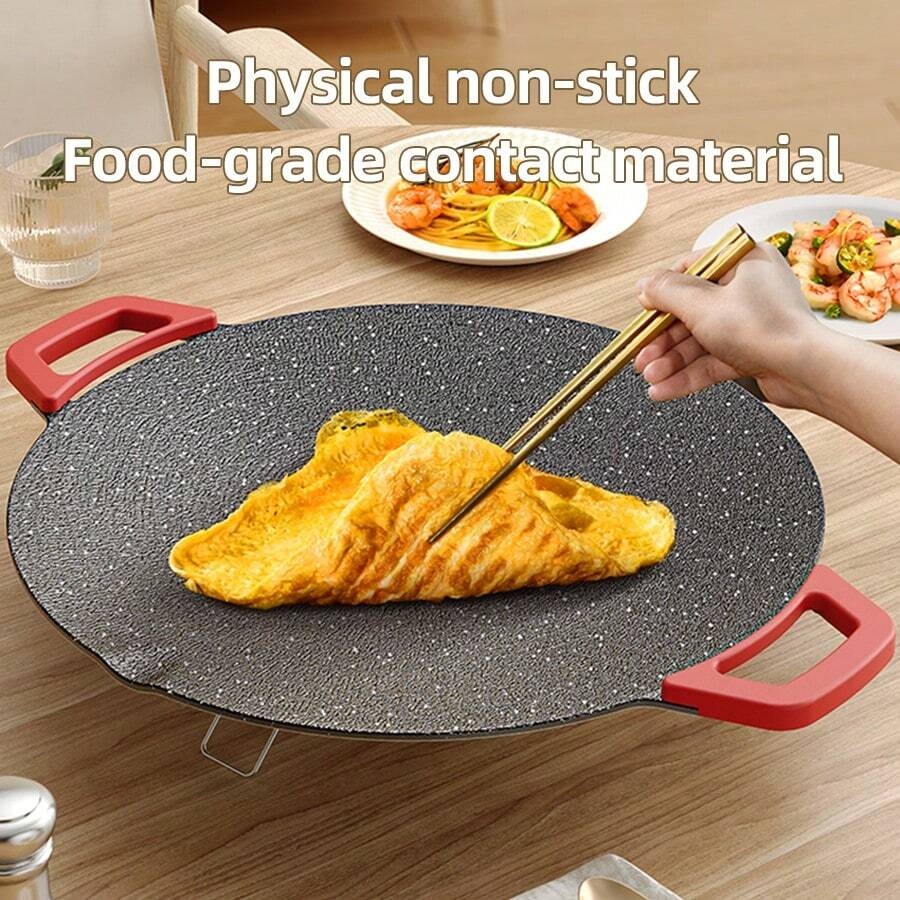 Grill being used to cook various foods