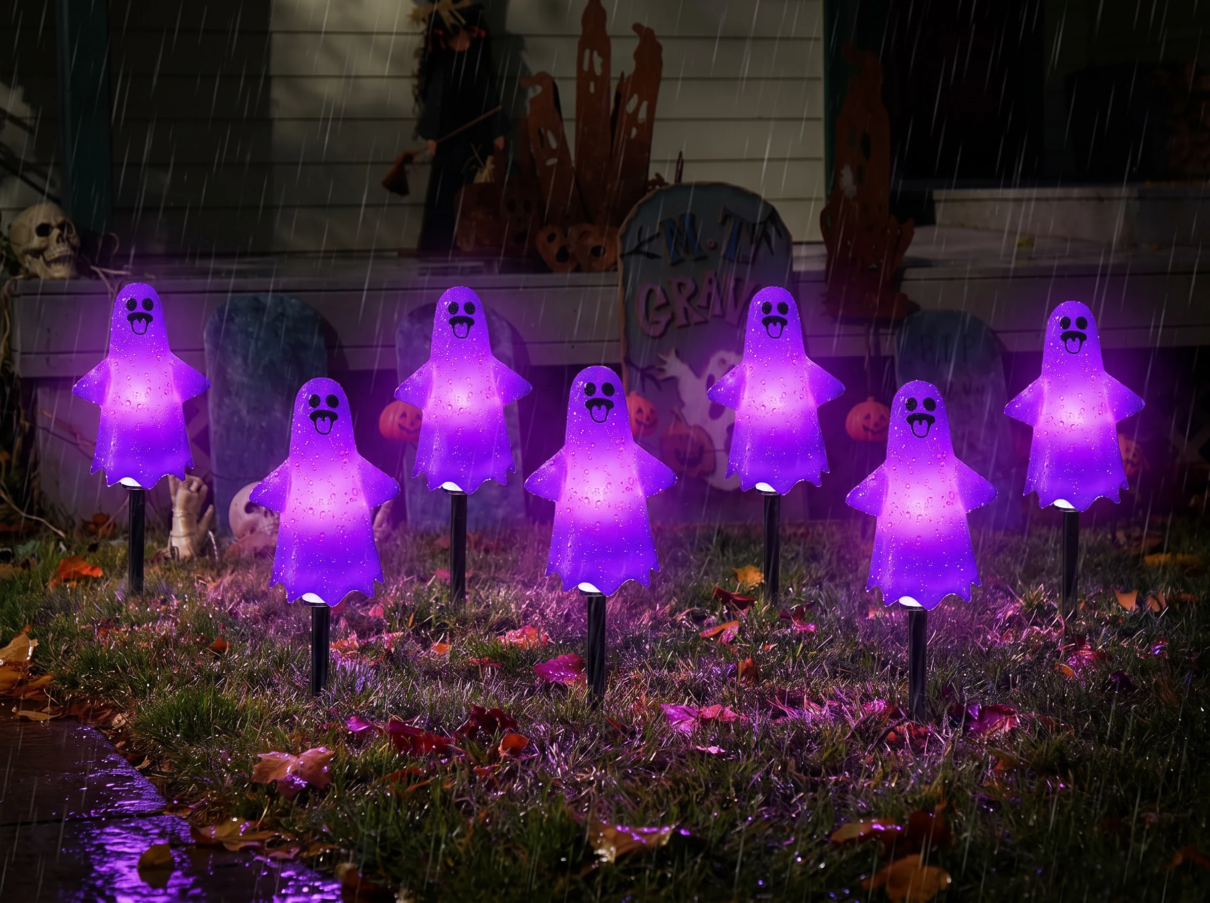 The ghost lights still glowing purple in a wet garden during light autumn rain, with raindrops beading on the smooth shells