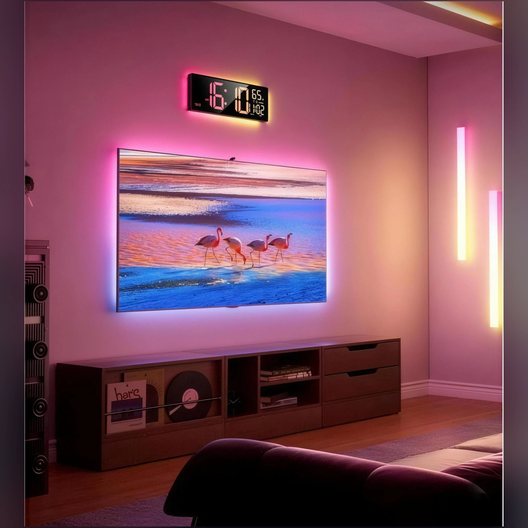 Smart RGB clock glowing above a wall-mounted TV in a living room