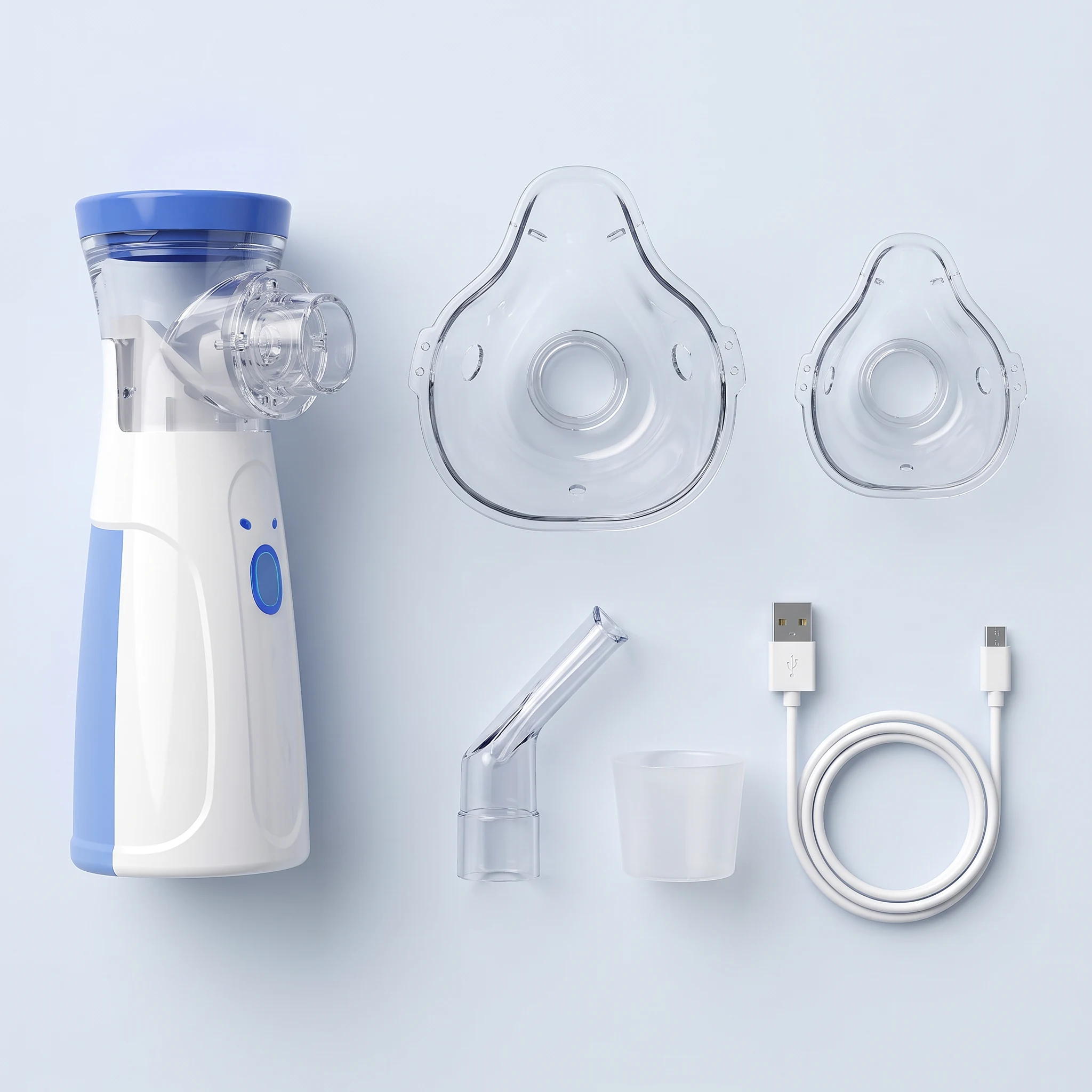 Flat lay of the kit: nebulizer, two masks, mouthpiece, cup and USB cable