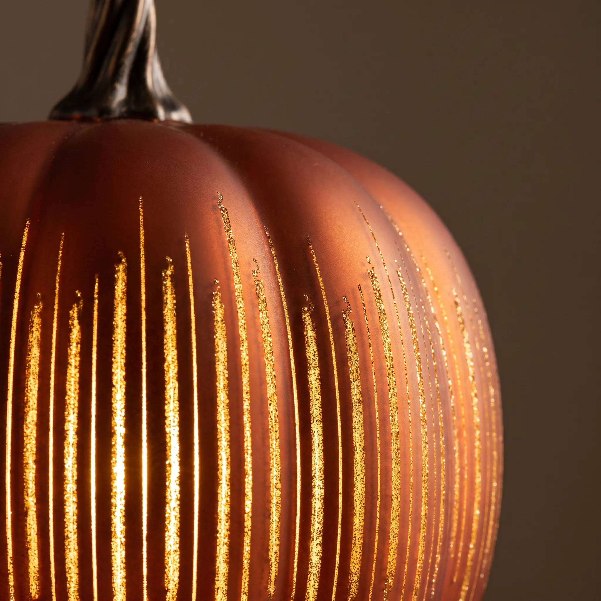 Macro of the etched lines glowing on a Starry Night glass pumpkin