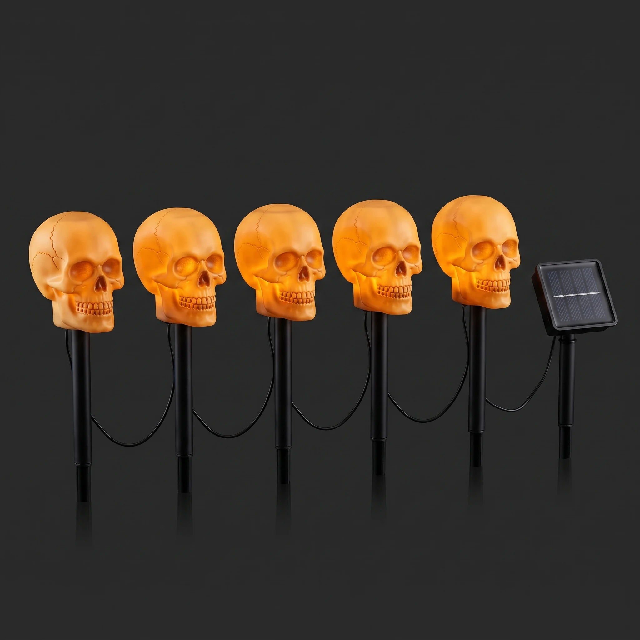 What comes in a set: five skull stakes wired to one small square solar panel