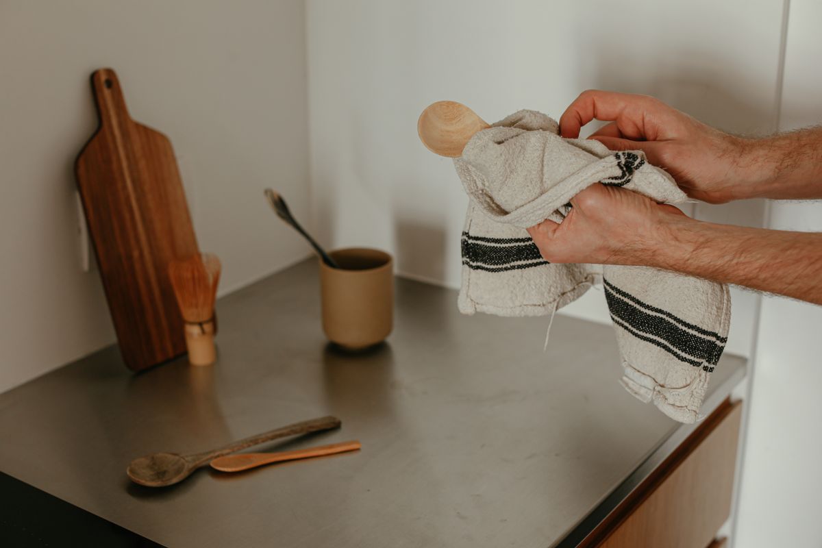 A warm and inviting kitchen counter with wooden utensils and a cozy ambiance.