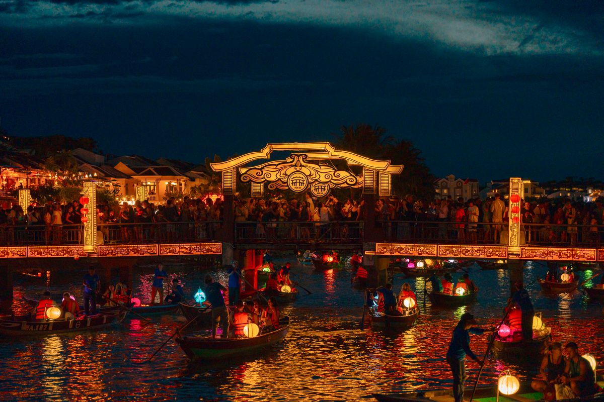 Colorful lanterns illuminate the night in Hแปi An during a festive evening celebration.
