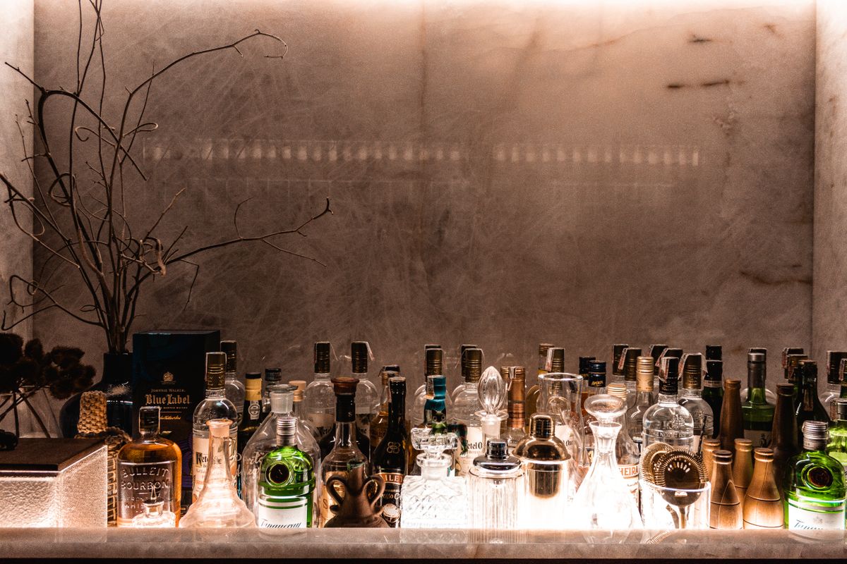 A sophisticated bar setup showcasing various liquor bottles for an upscale ambiance.