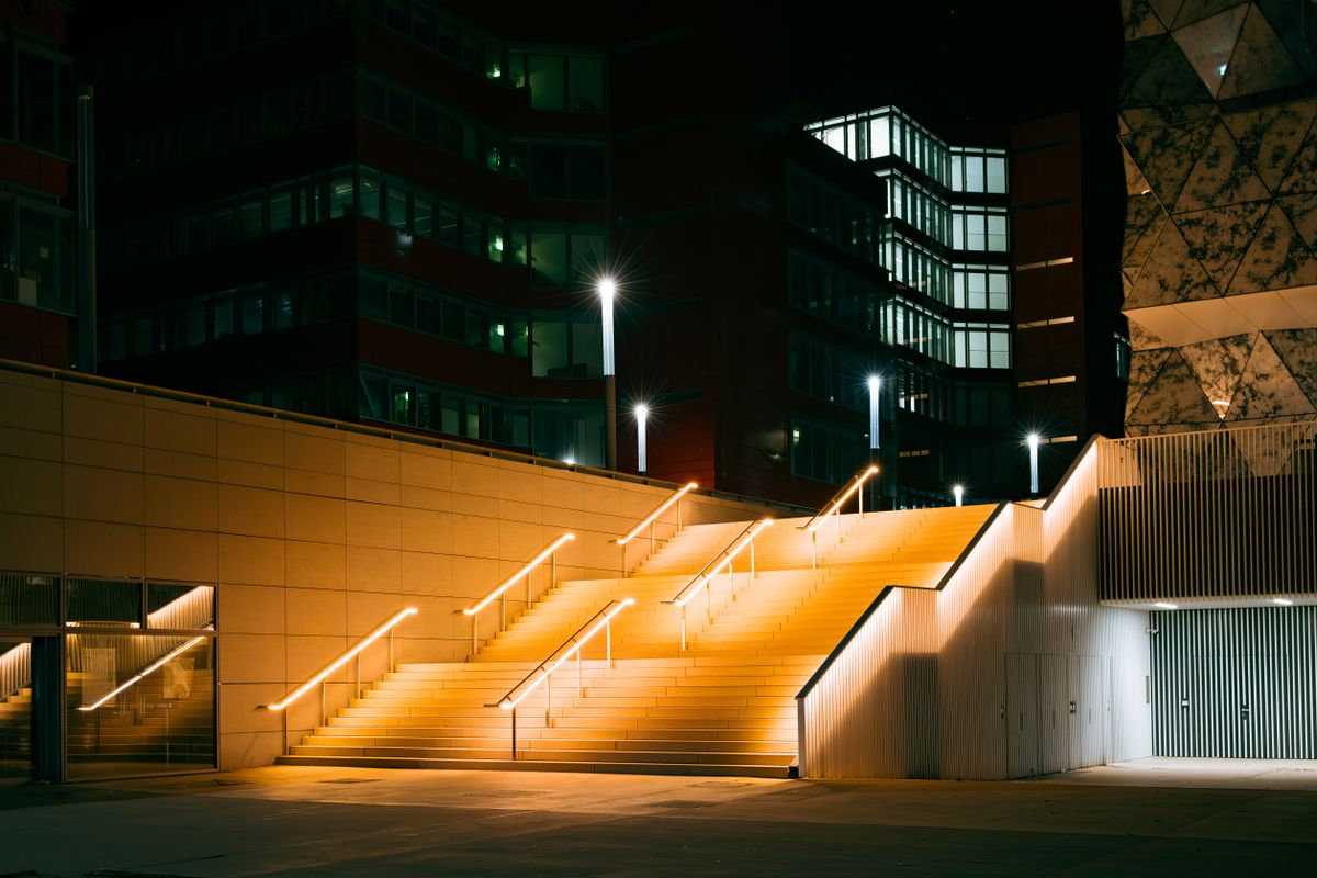 Illuminated stairs and buildings at night in Esch-sur-Alzette, Luxembourg.