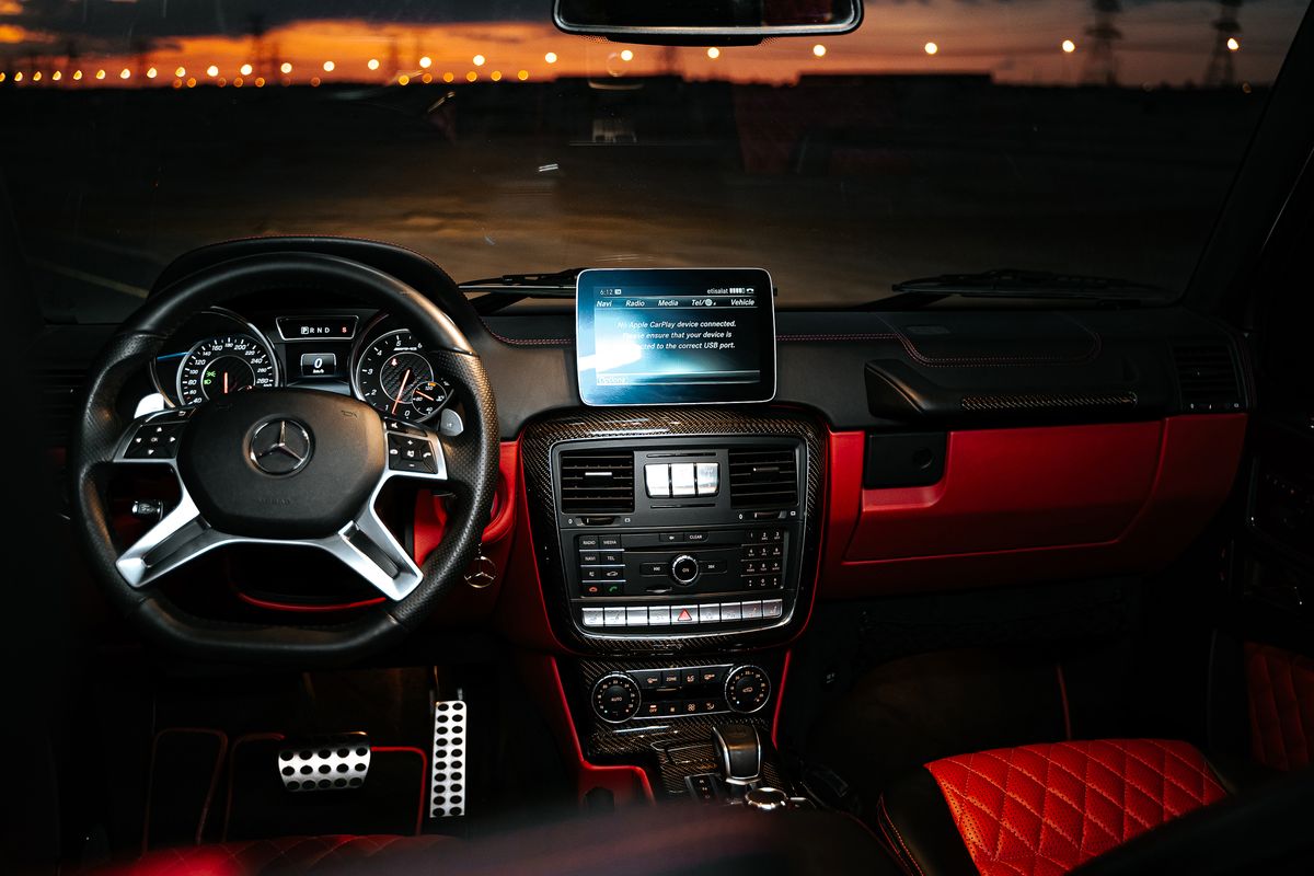 Explore the luxurious interior of a Mercedes car, showcasing premium leather and advanced dashboard design at night.