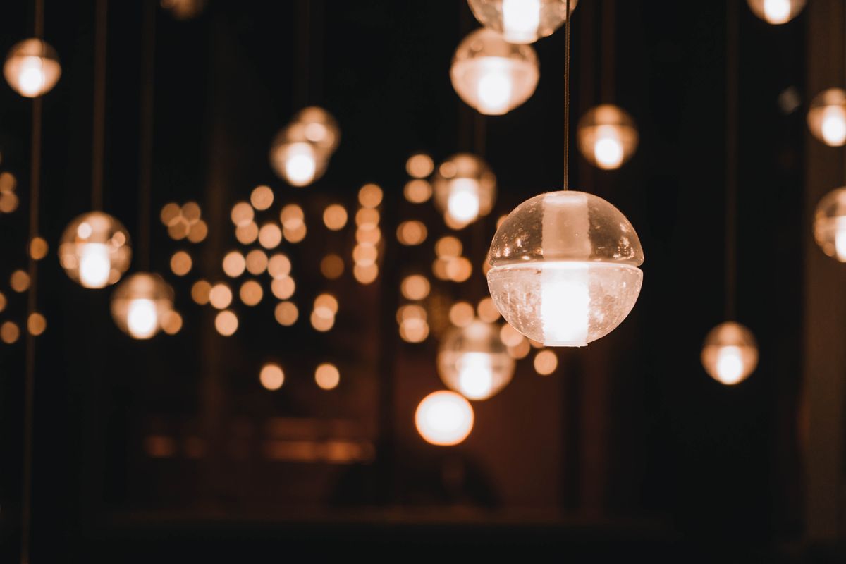 Captivating bokeh of softly illuminated pendant lights creating a warm ambiance.