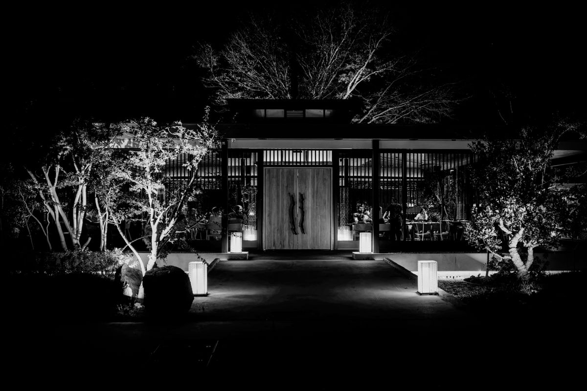 Elegant outdoor dining scene at night in Canberra, Australia, highlighting cozy ambiance and lighting decor.