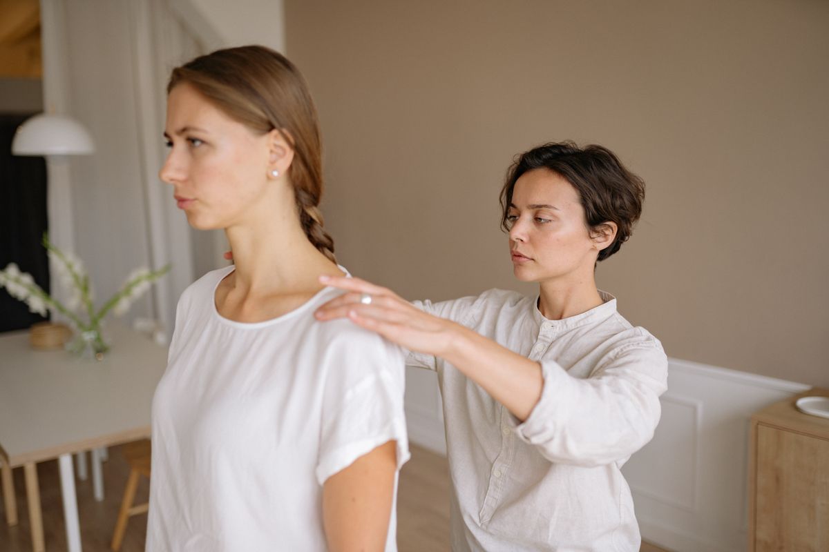 Adult women receiving a therapeutic massage in a calm indoor setting, promoting wellness and relaxation.