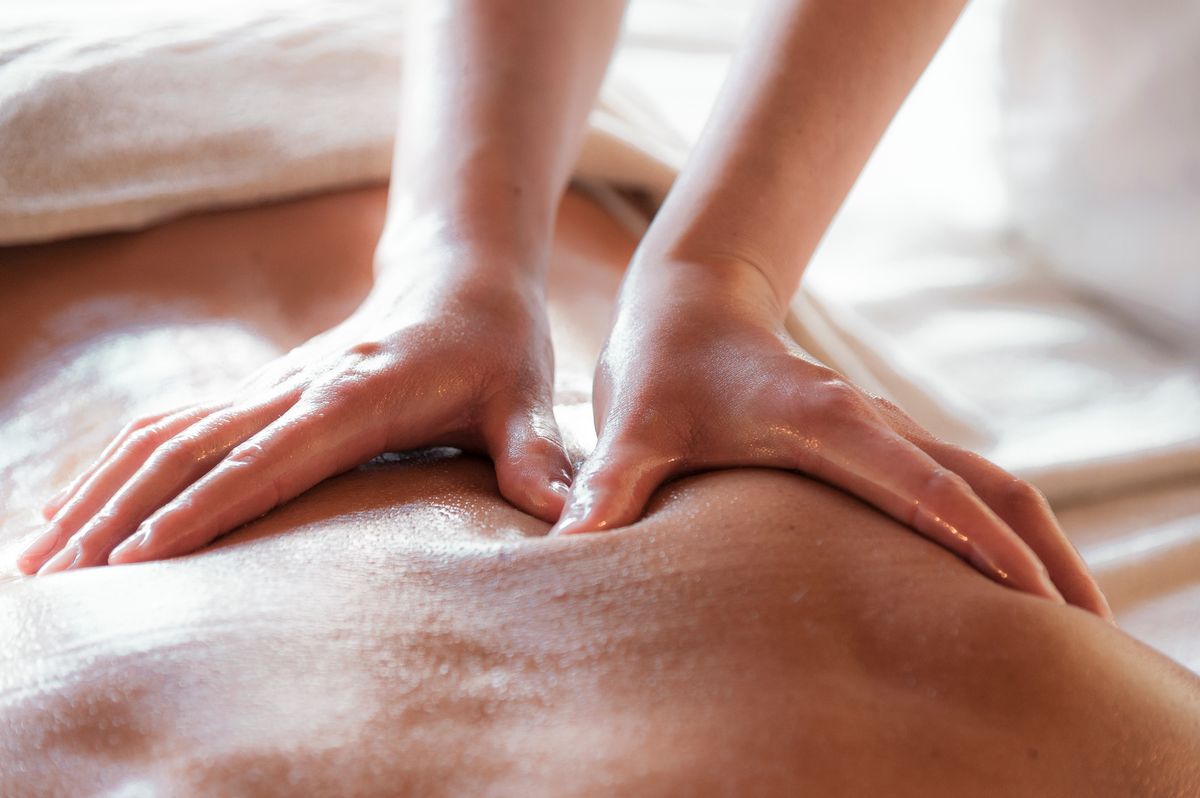 Close-up of a soothing back massage promoting relaxation and wellness.