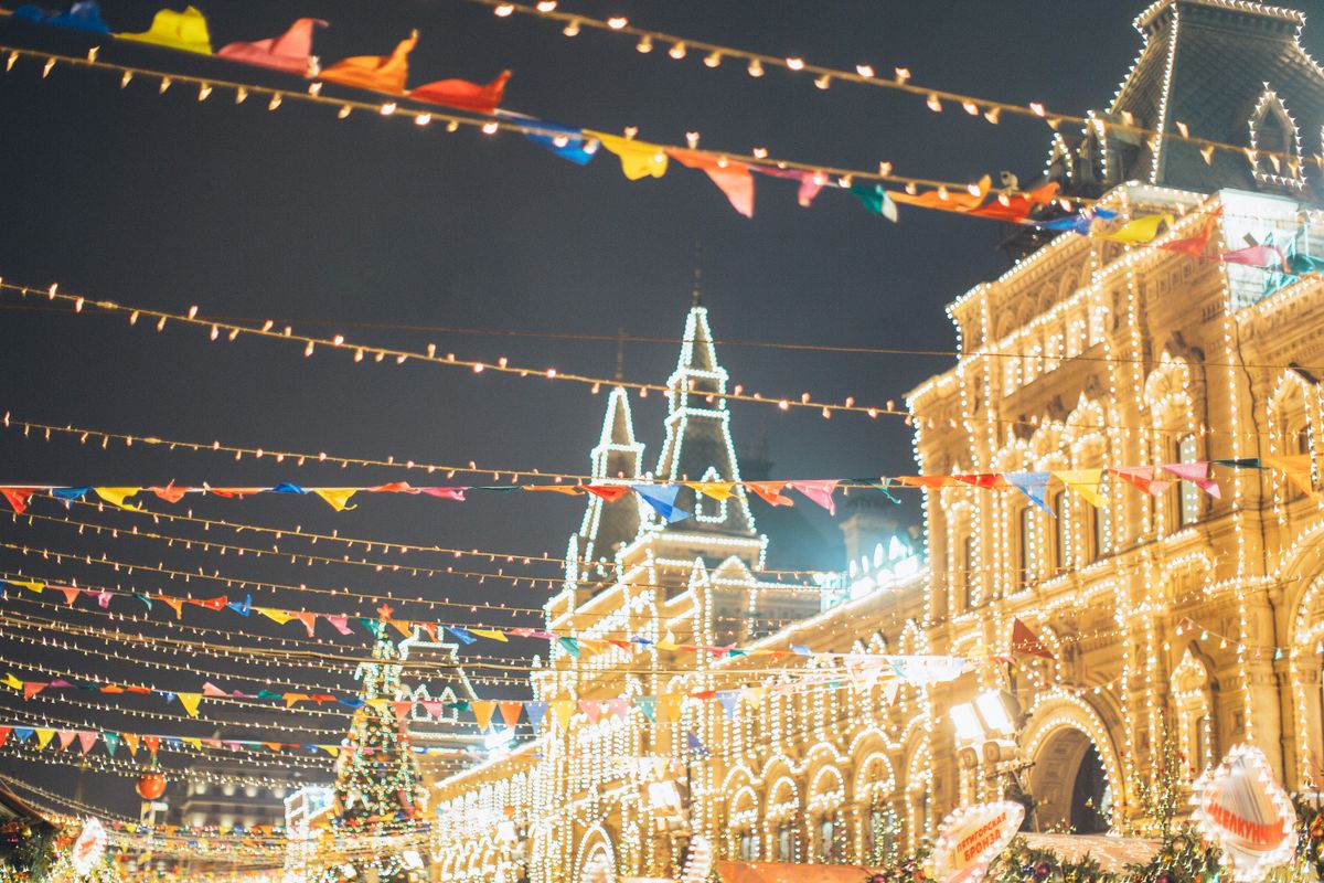 Vibrant Christmas lights and festive atmosphere in a colorful outdoor night scene.
