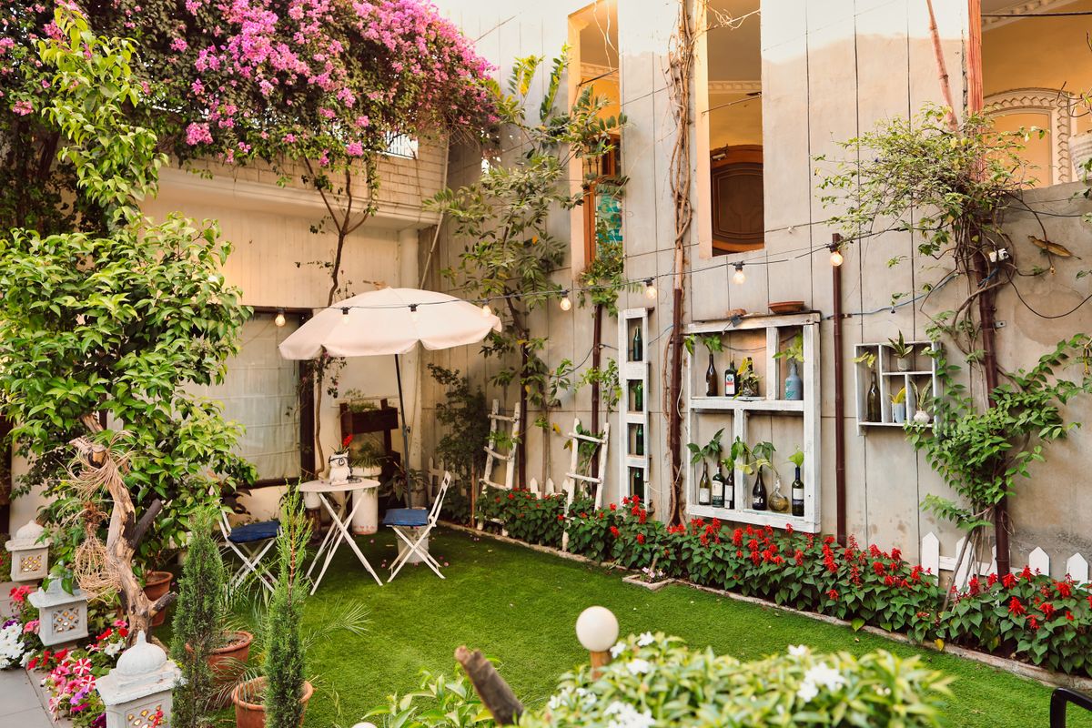 Beautiful outdoor patio with floral decor, perfect for relaxation and small gatherings.