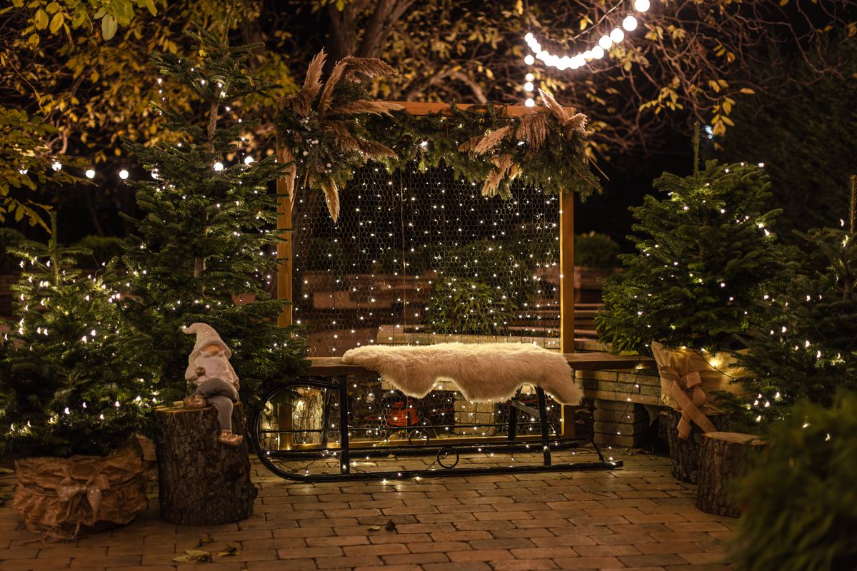 Charming outdoor Christmas scene with festive lights and ornaments, perfect for holiday ambiance.