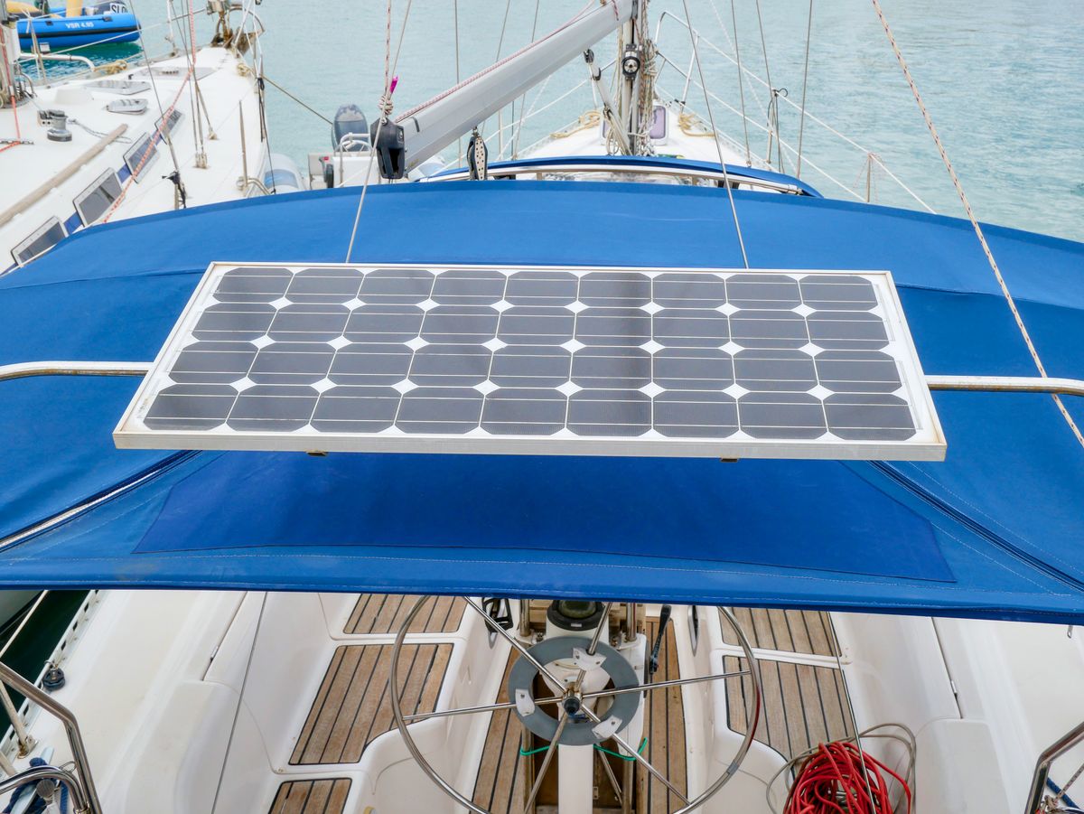 View of a solar panel installed on a yacht deck for sustainable energy.