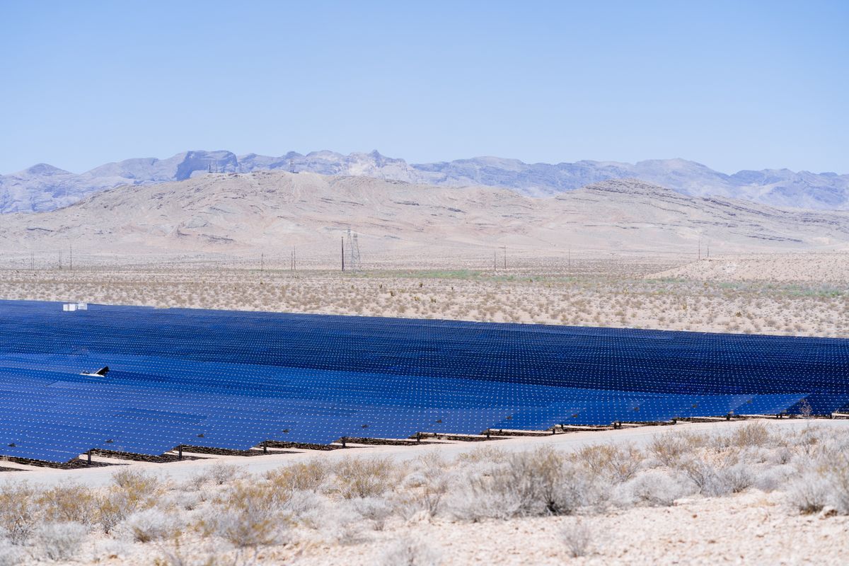 Stunning view of a large solar farm harnessing energy in a vast desert landscape.