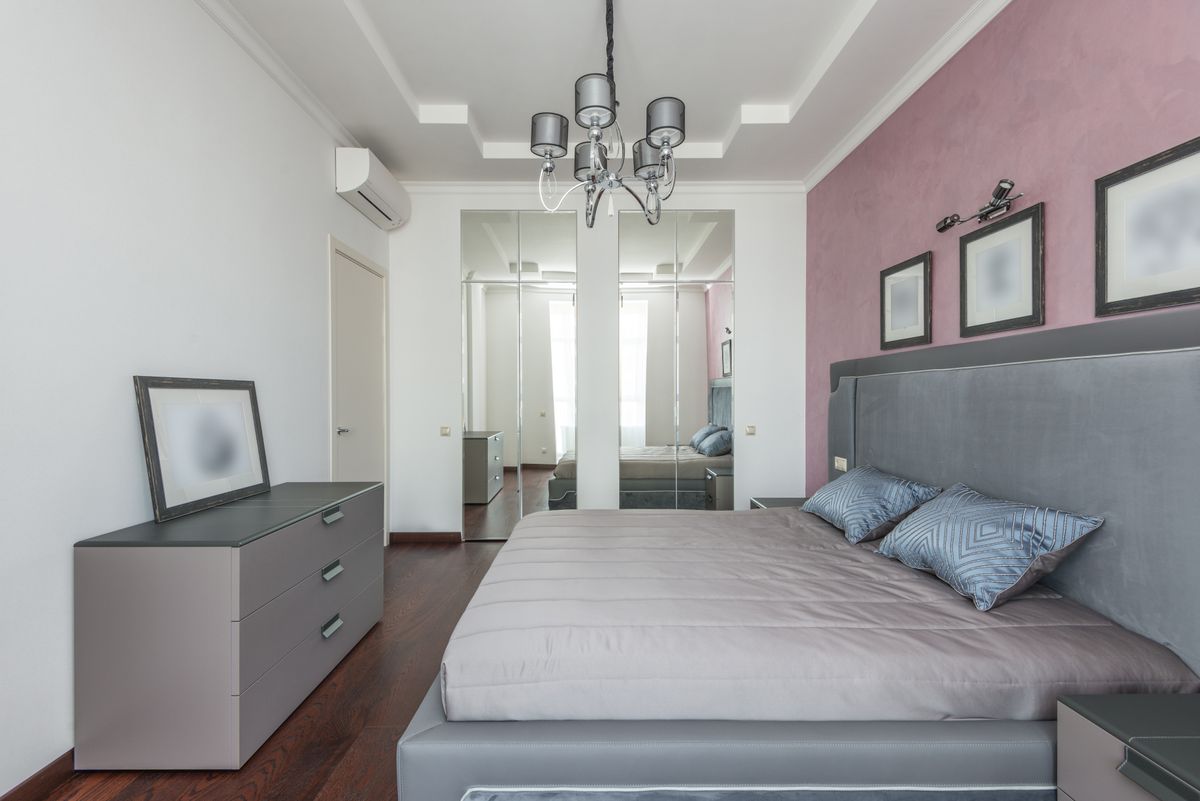 Contemporary bedroom interior with a king-sized bed and elegant decor for a luxurious feel.