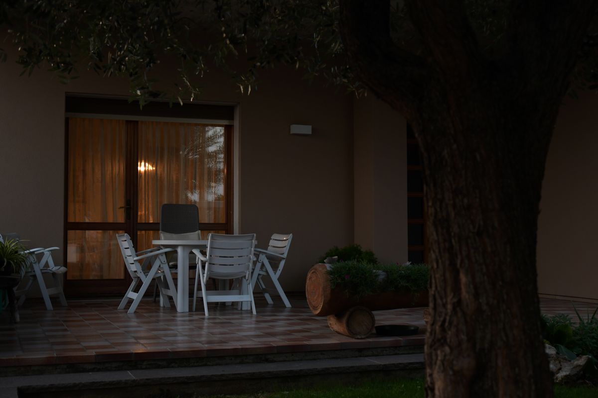 Inviting patio terrace scene at dusk in Rizza, Veneto, Italy, ideal for relaxation.