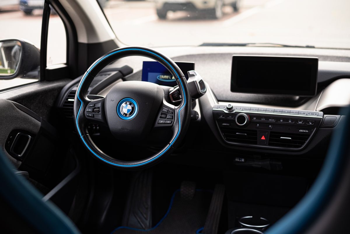 Sleek and modern interior of a car showcasing a detailed view of the steering wheel.