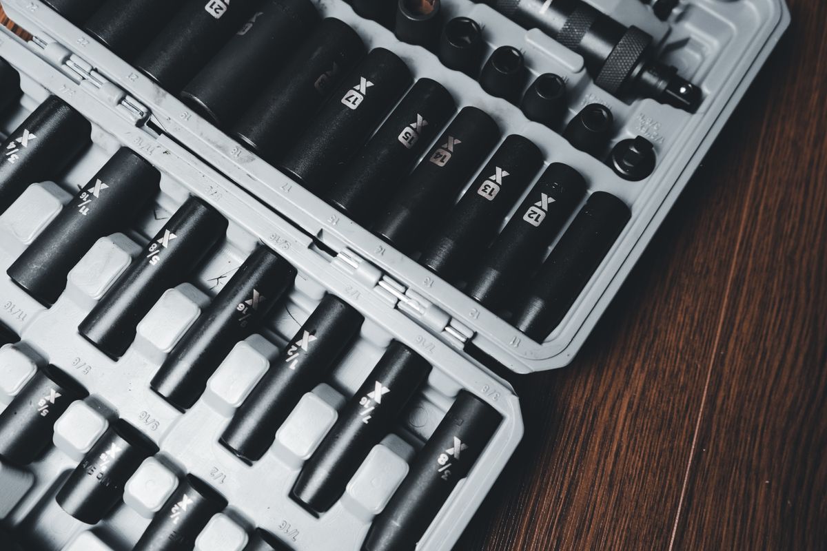 A detailed close-up of a socket tool set neatly arranged in a hard case, ideal for mechanical work.