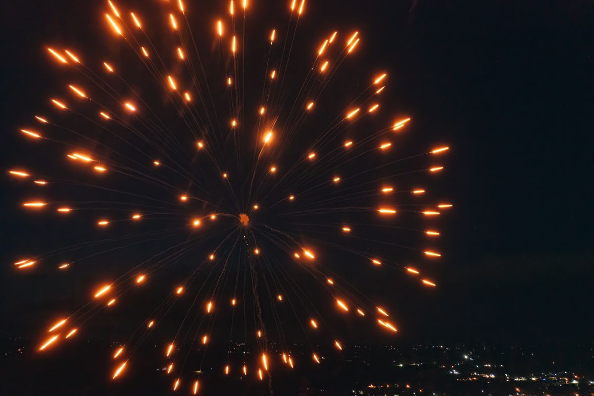 Vibrant firework display lighting up the night sky in Plainview, Minnesota.