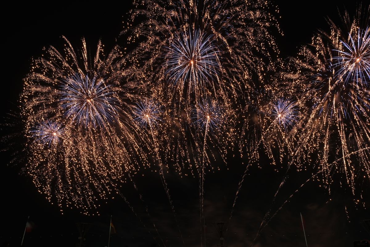 A dazzling fireworks display lighting up the night sky with colorful explosions.