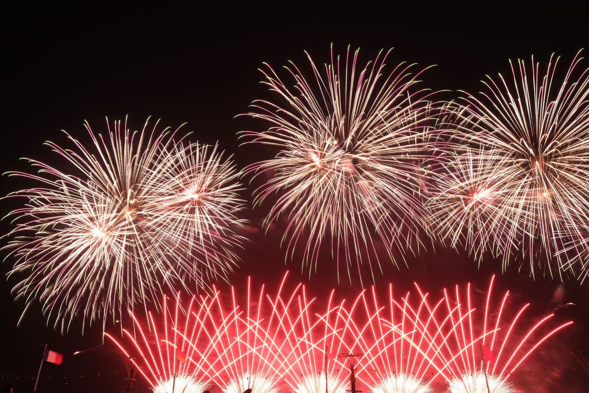 A stunning fireworks display lighting up the night sky with vibrant colors during a festive celebration.