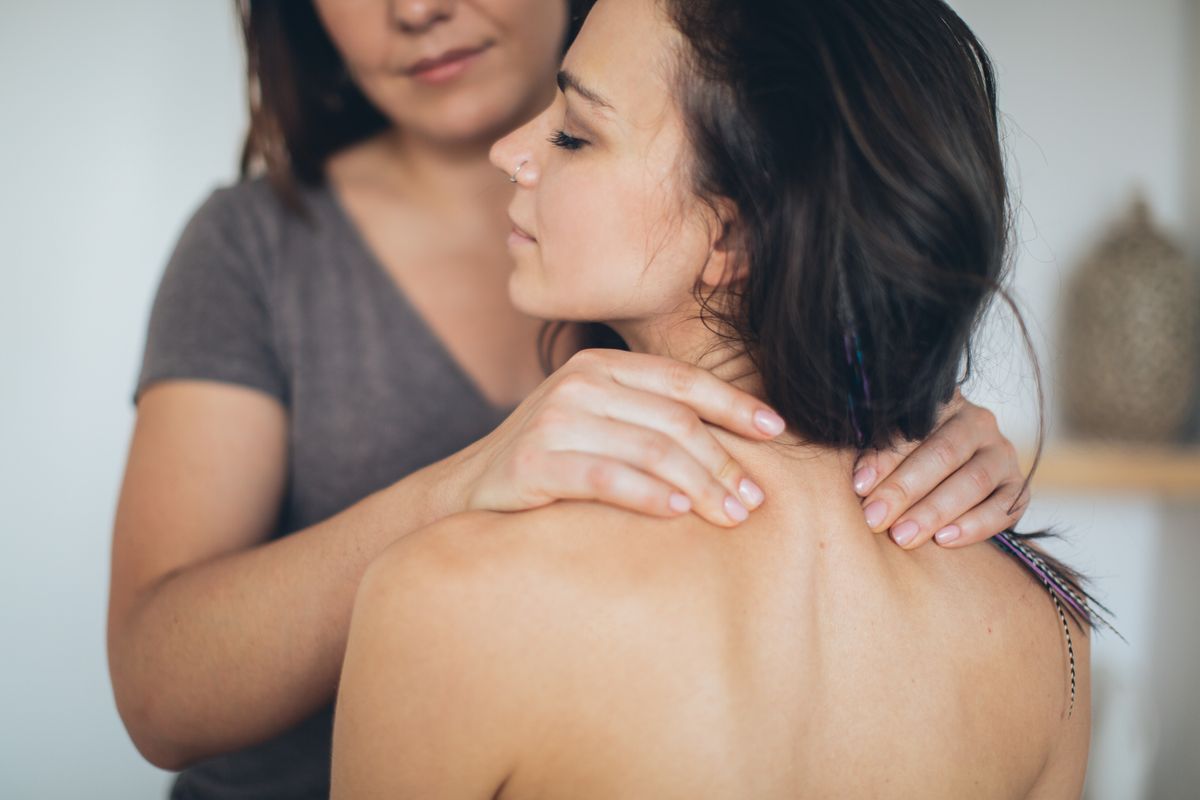 A calming massage therapy session focused on wellness and relaxation in a serene spa environment.