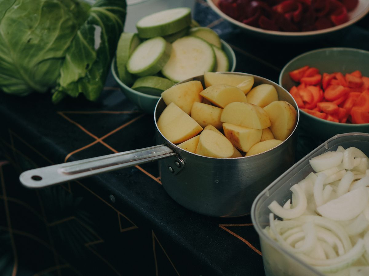 Mixed vegetables and potatoes prepared for a healthy meal.