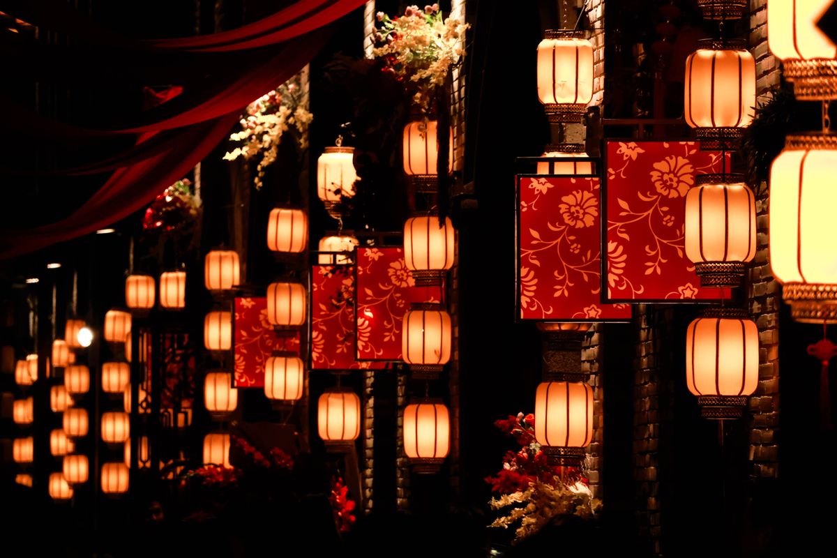 A stunning display of traditional lanterns lighting up a street at night, creating a festive atmosphere.