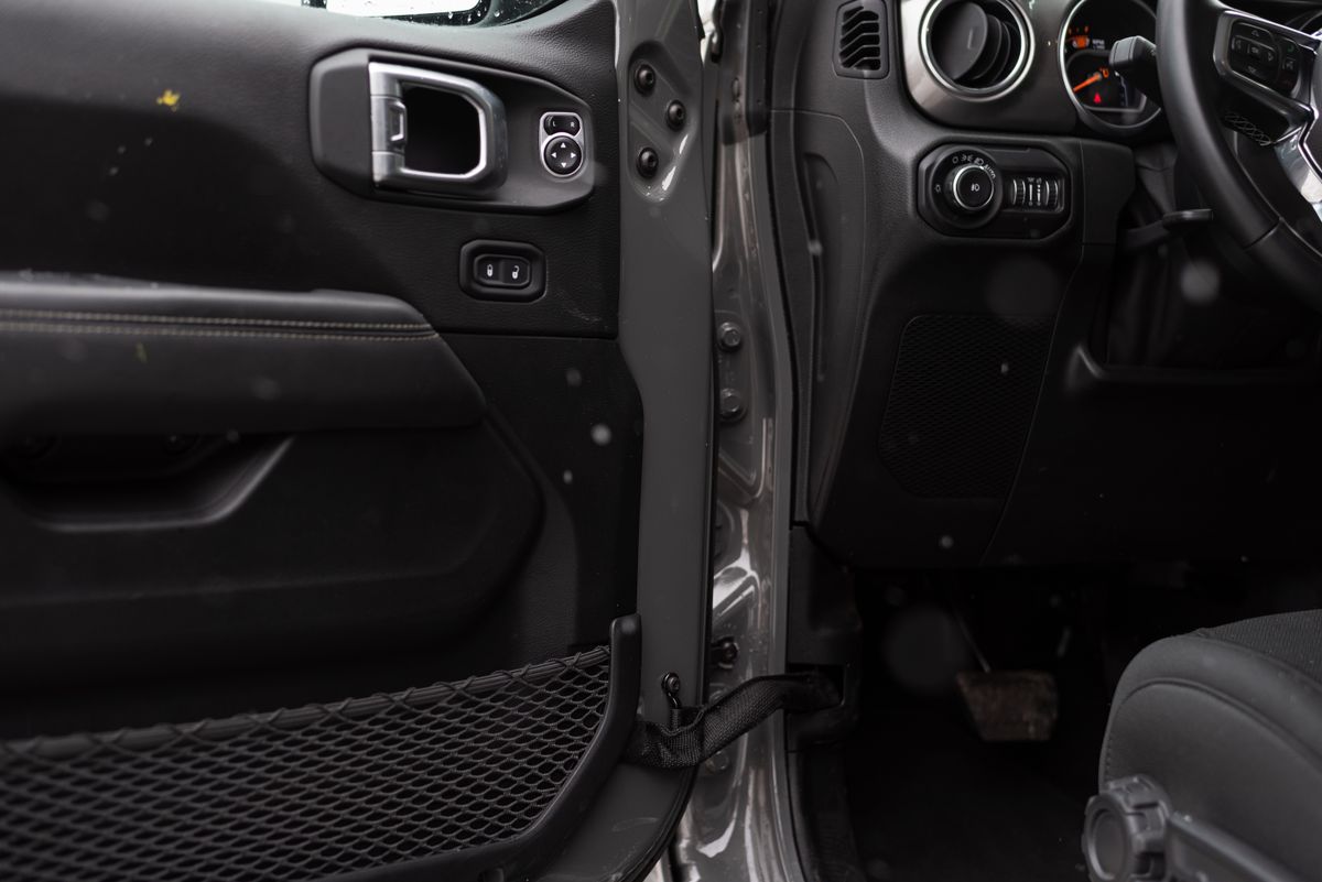 Detailed interior shot of a car showing the door panel and part of the dashboard.