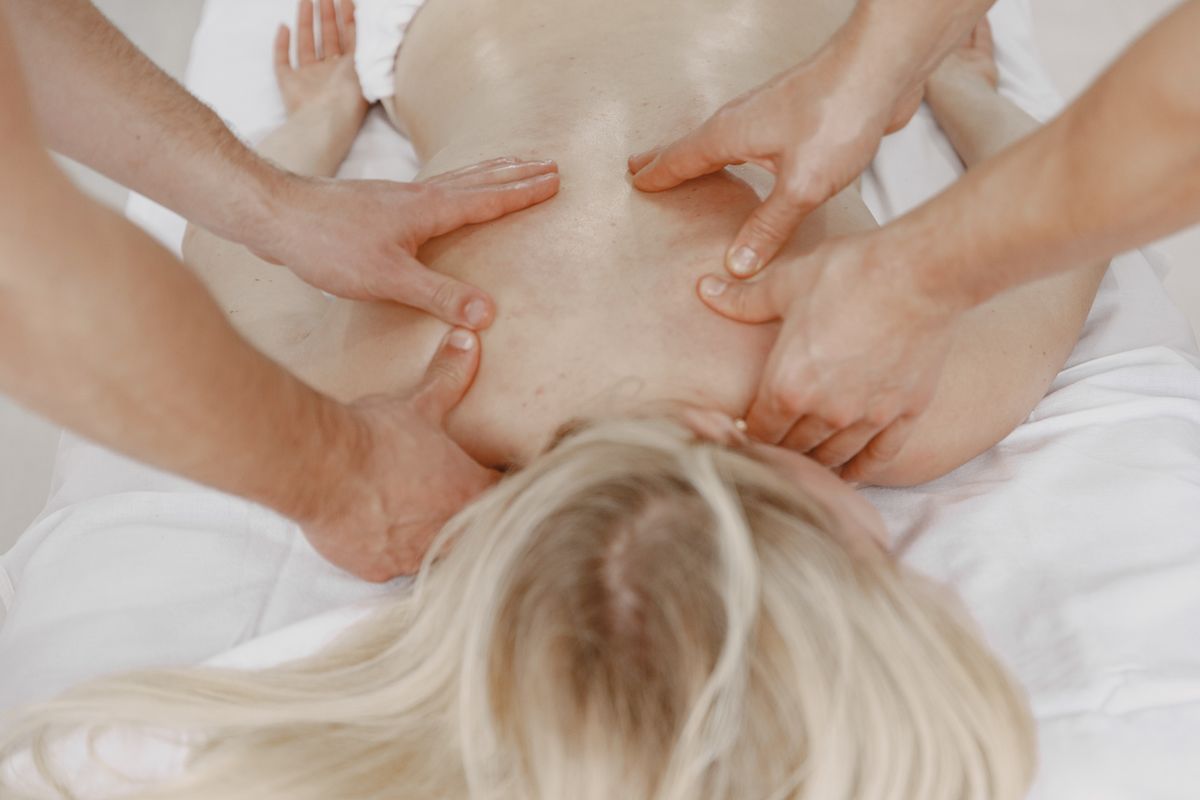Close-up of a back massage providing relaxation and stress relief indoors.