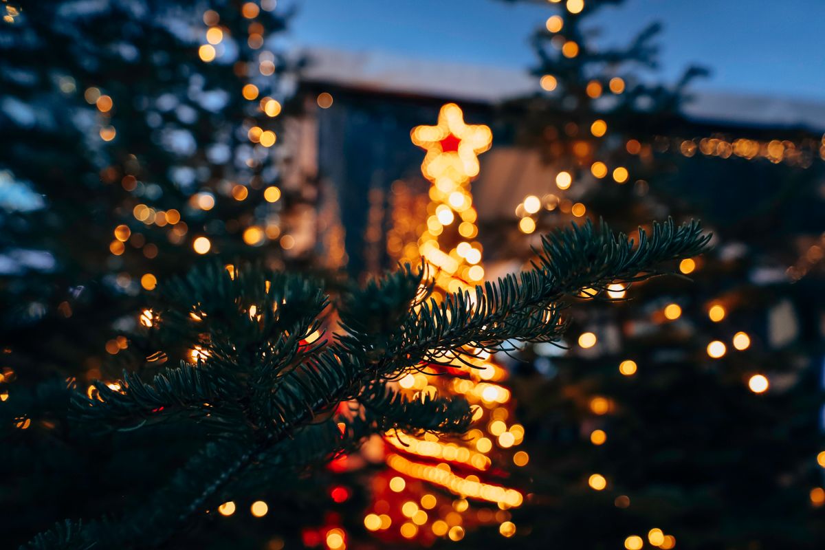 Close-up of a decorated Christmas tree with glowing lights in Vancouver, capturing a festive winter evening.