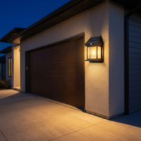Wall lights lighting up a garage and driveway
