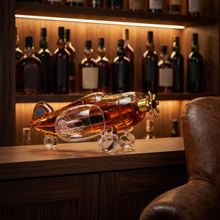 The aircraft decanter on a warmly lit home-bar shelf