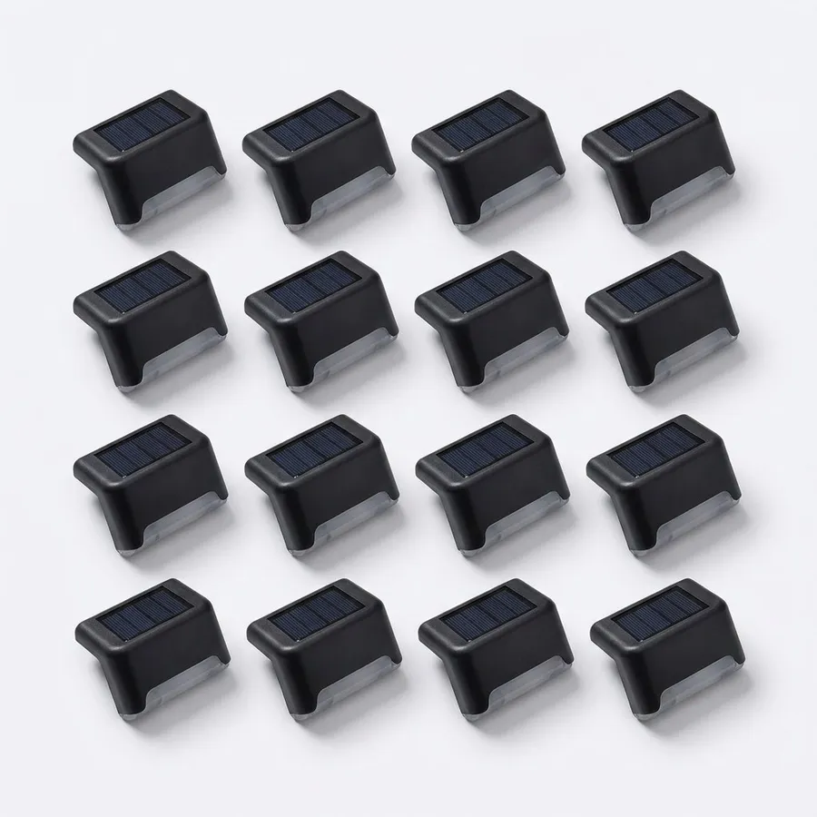 Sixteen matte-black solar deck lights laid out in a four by four grid on a white surface