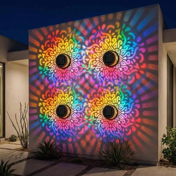 Four mandala lights on a modern wall casting rainbow mandalas