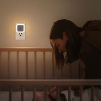Night light glowing over a crib