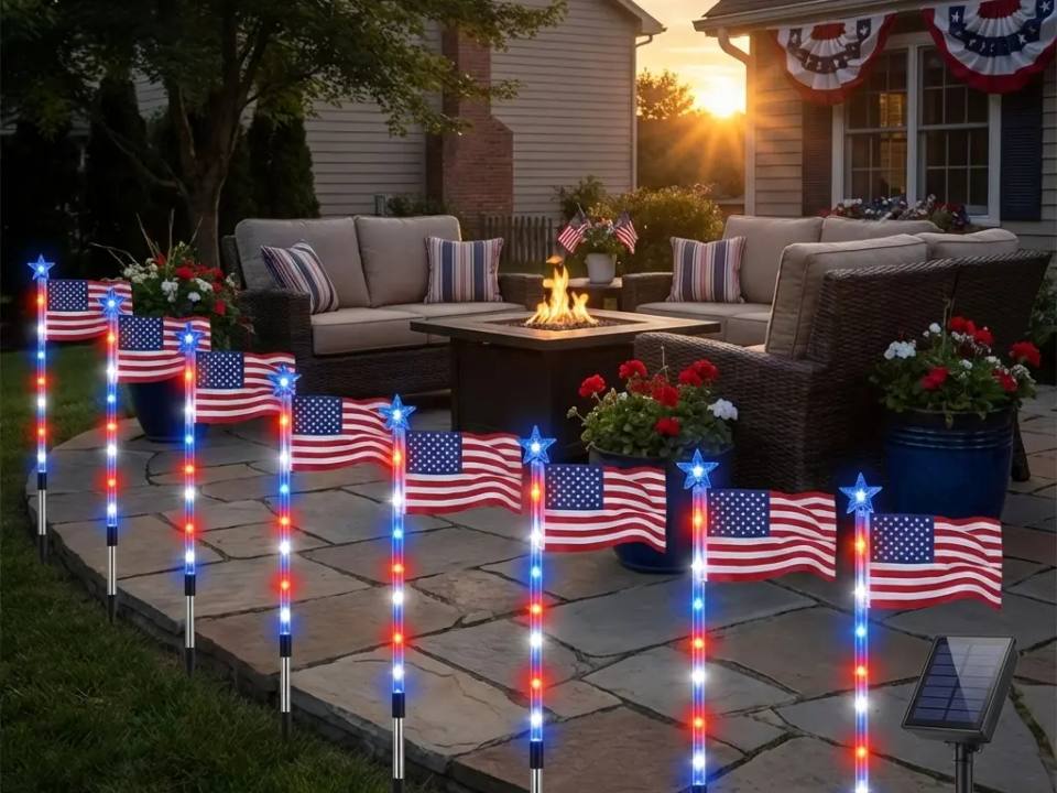 American flag solar lights lining a patio walkway at golden hour