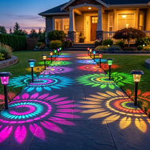 Rainbow sunburst pathway lights at dusk