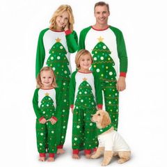 Family in matching green Christmas tree pajamas