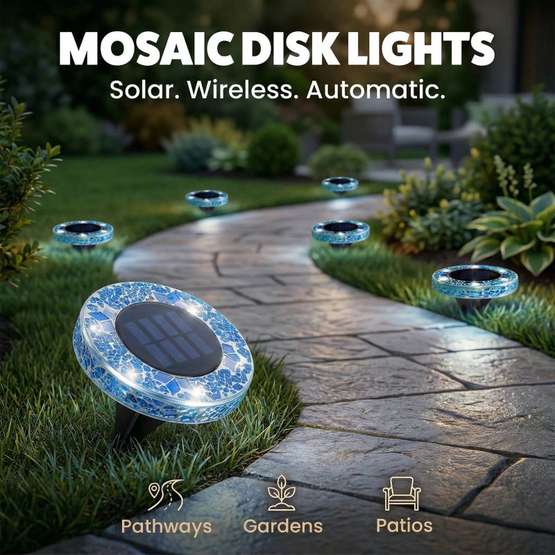 Solar mosaic disk light glowing in a garden at night