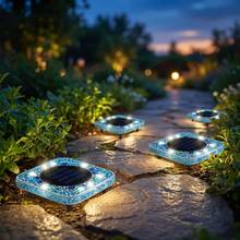 Blue square mosaic solar disk light on stone pavers