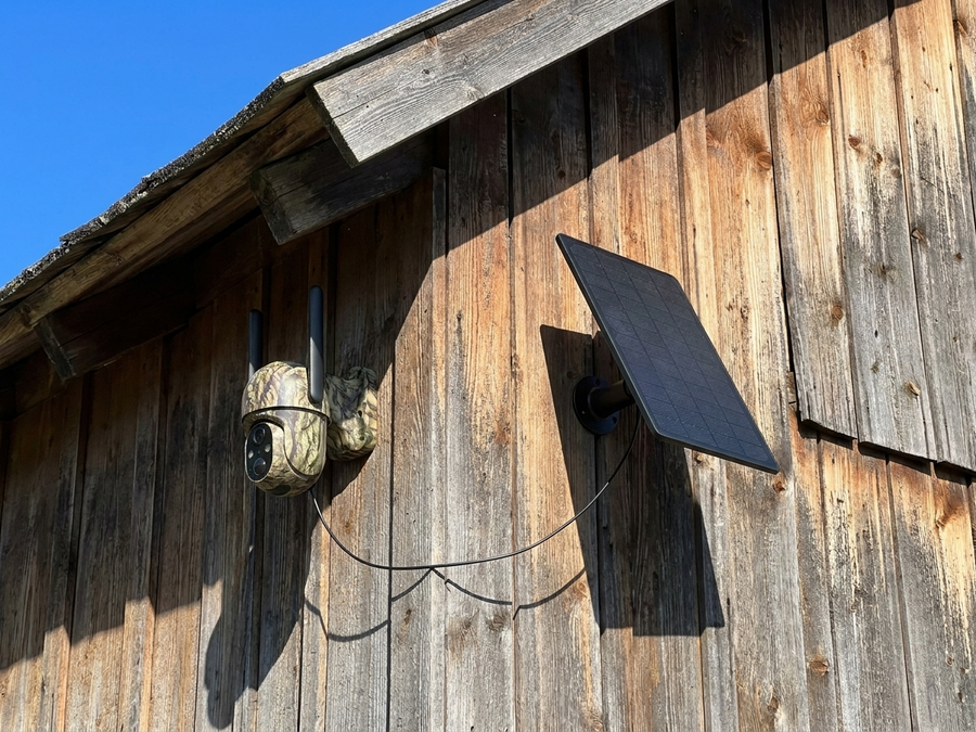 Camera and 6W solar panel mounted on a barn wall