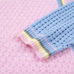Patchwork sleeve cardigan, waffle knit and striped rib cuff, close-up